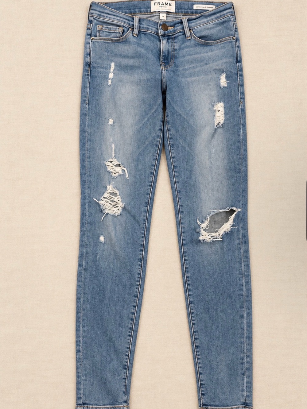 Frame Denim Light Wash Distressed Skinny Jeans